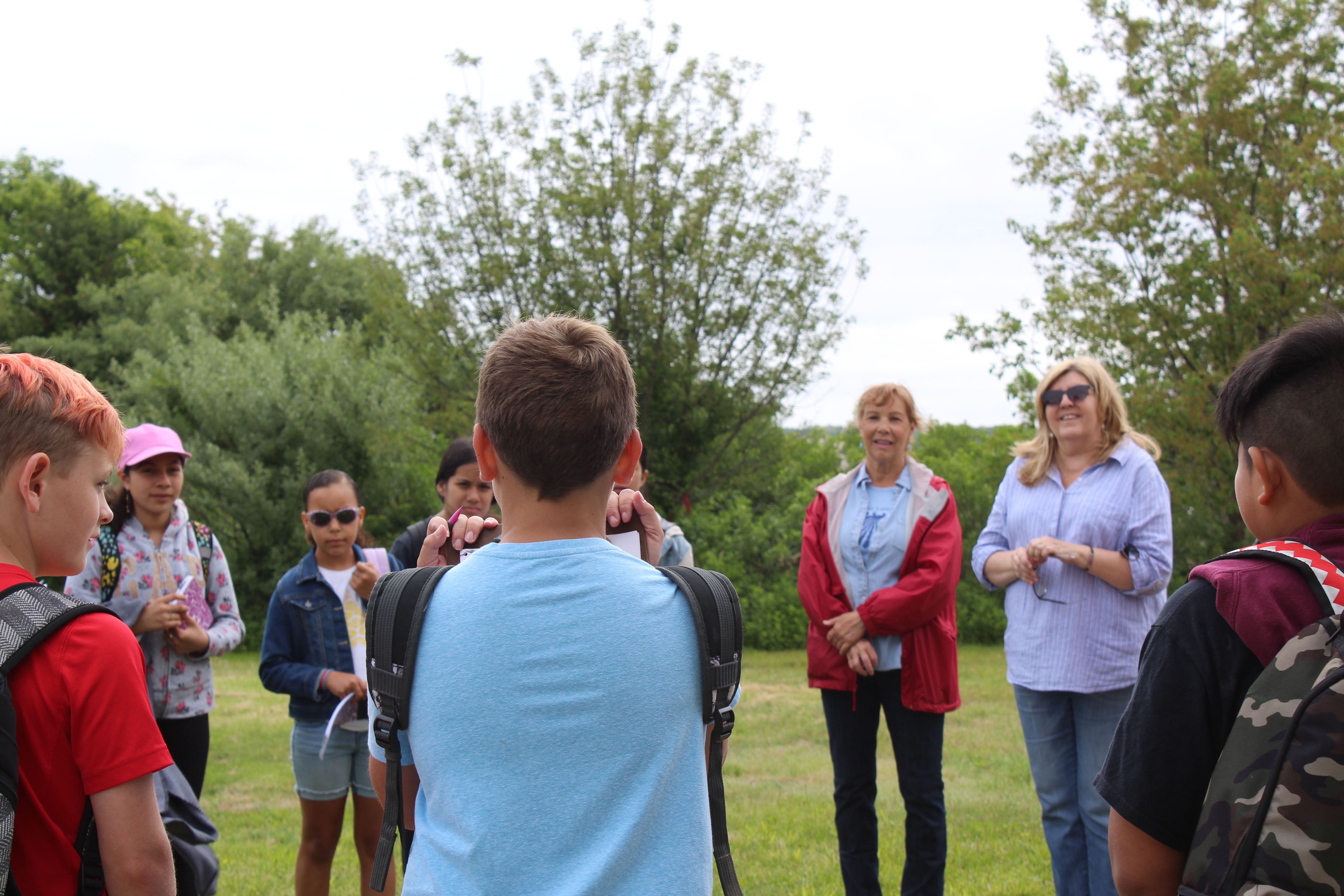 Greenport 5th graders at the Widow's Hole Preserve listening to Denise Markut