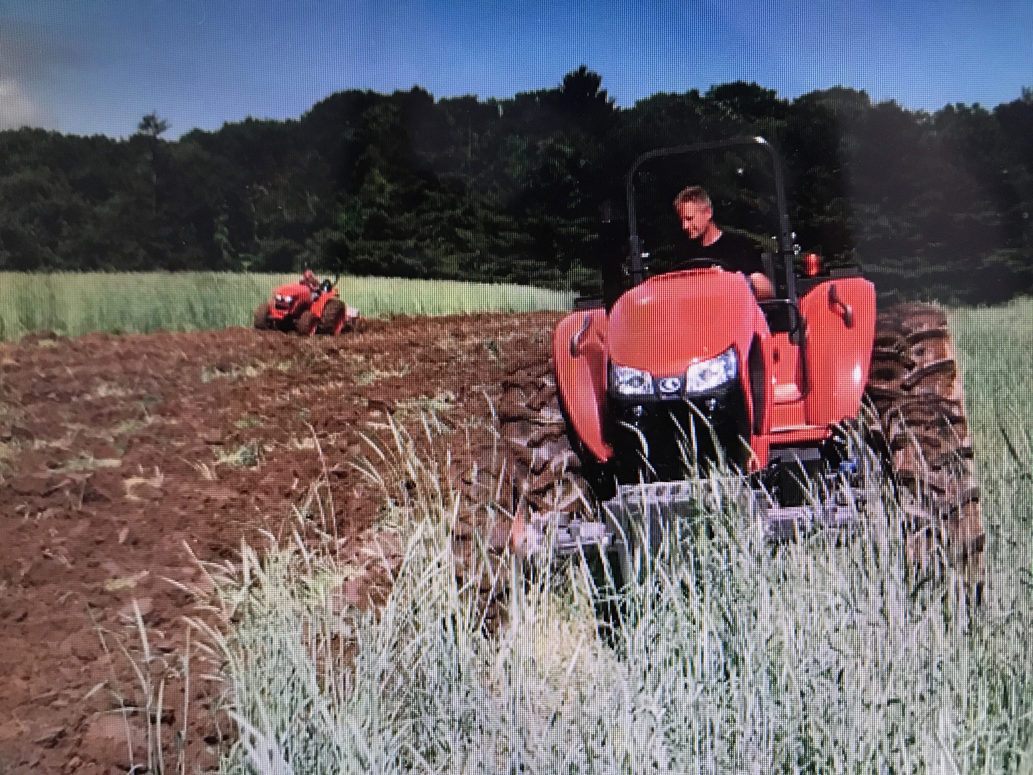 Dan Heston on a red tractor