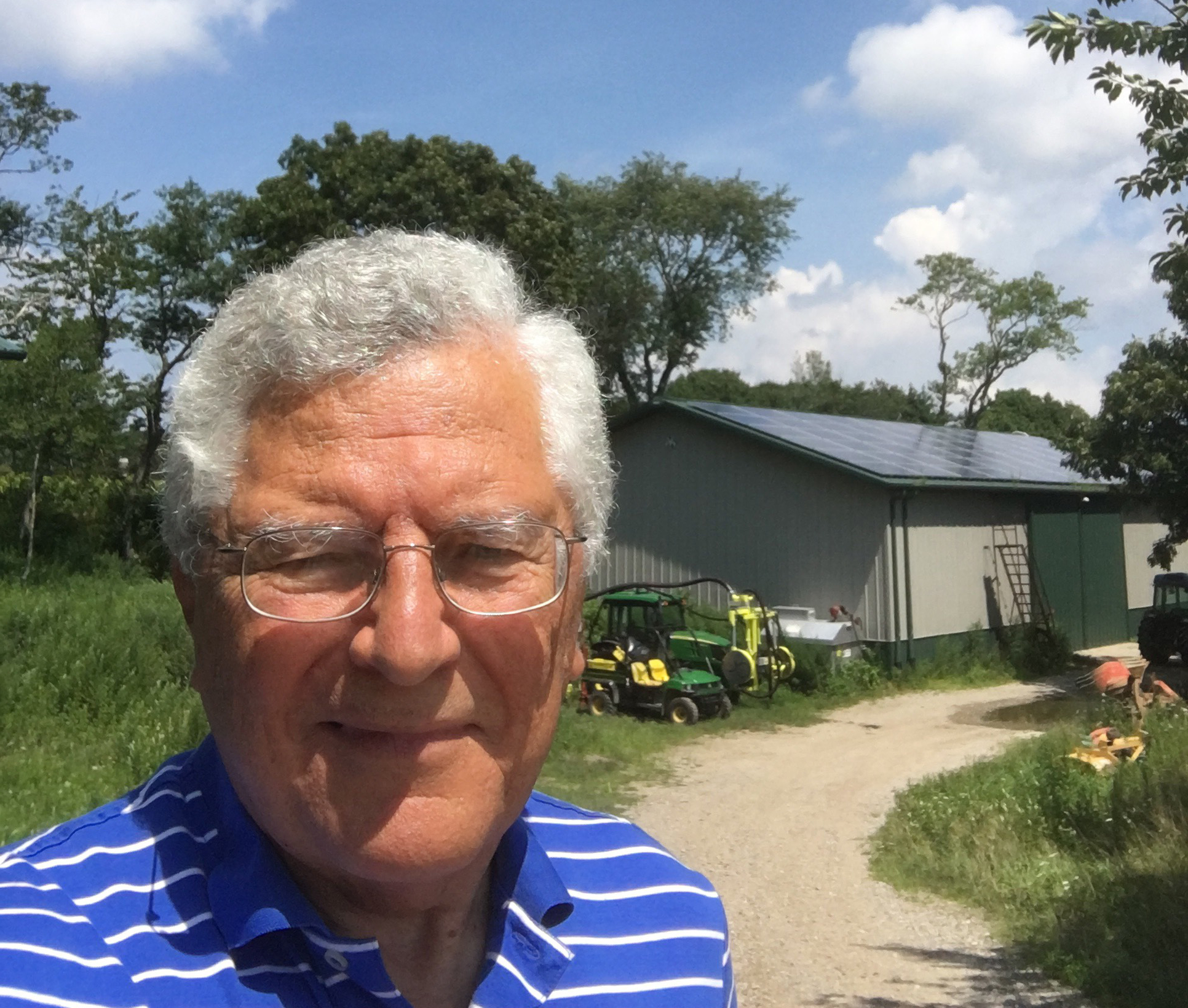 Massoud in front of a shed at Paumanok Vineyards