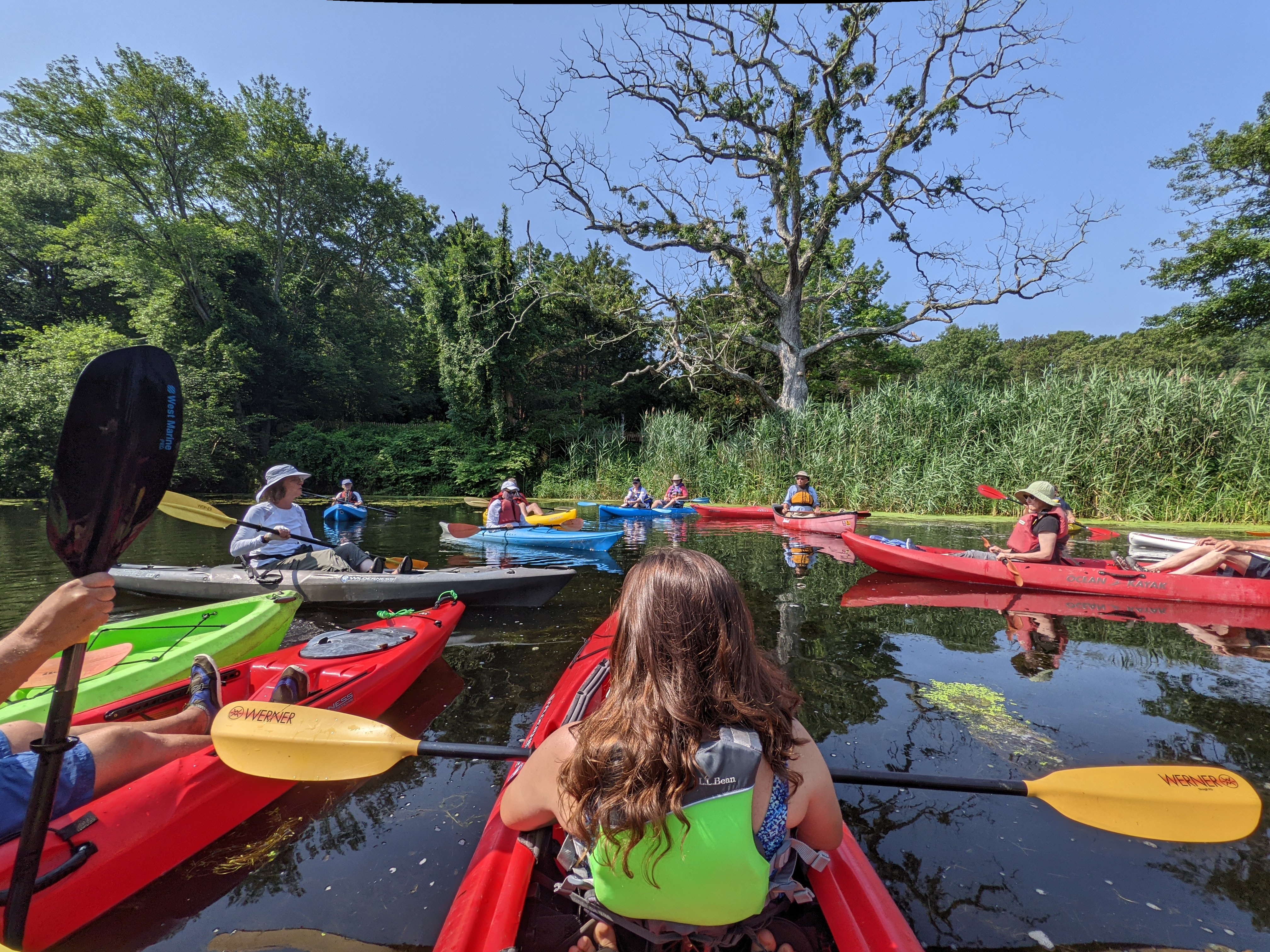 Paddlers listening to Mike Bottini